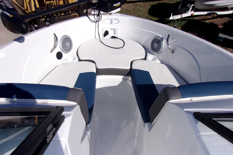 Slide: The Image of Interior of 2021 Tahoe 550 TF boat with blue and white seating. - 11