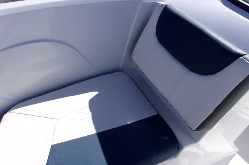 Slide: The Image of 2021 Tahoe 550 TF boat seat with white and navy upholstery. - 12