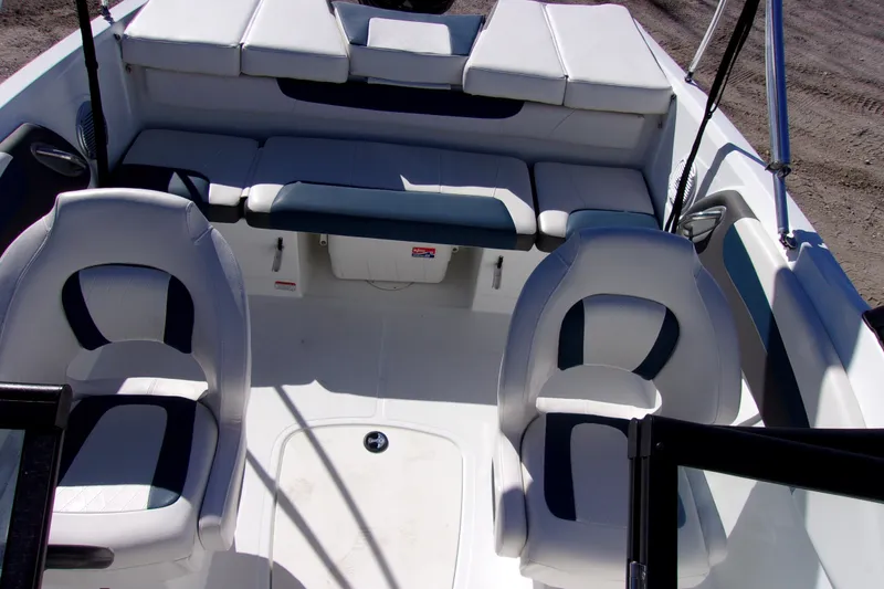 Slide: The Image of 2021 Tahoe 550 TF boat interior with white and blue seating arrangement. - 14
