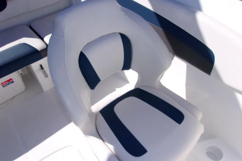 Slide: The Image of White and blue seating on 2021 Tahoe 550 TF boat interior. - 8