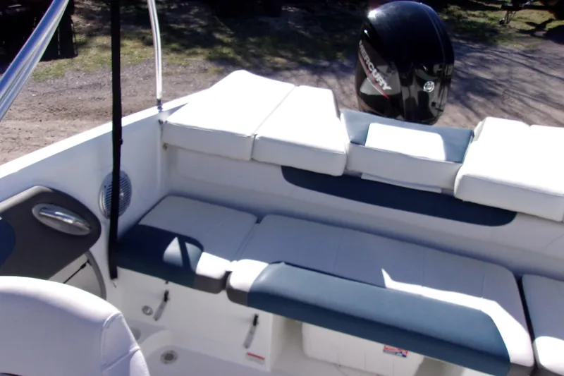 Slide: The Image of 2021 Tahoe 550 TF boat interior with seating and Mercury outboard motor. - 9