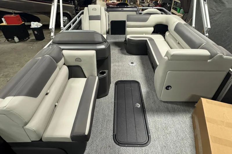 Slide: The Image of 2026 Sun Tracker SportFish 22 XP3 interior with gray and white seating, spacious layout. - 11