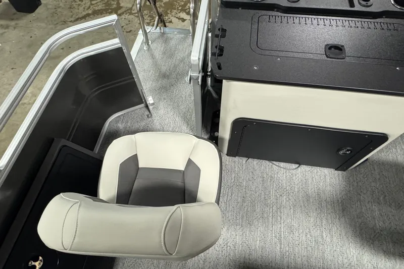 Slide: The Image of 2026 Sun Tracker SportFish 22 XP3 interior with seating and control panel. - 18