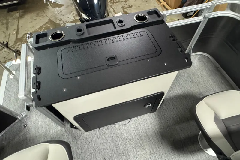 Slide: The Image of 2026 Sun Tracker SportFish 22 XP3 boat interior with fishing station and seating. - 19