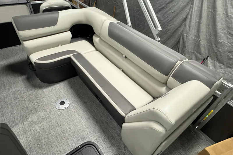 Slide: The Image of Luxurious seating on 2026 Sun Tracker SportFish 22 XP3 pontoon boat, featuring gray and cream upholstery. - 13