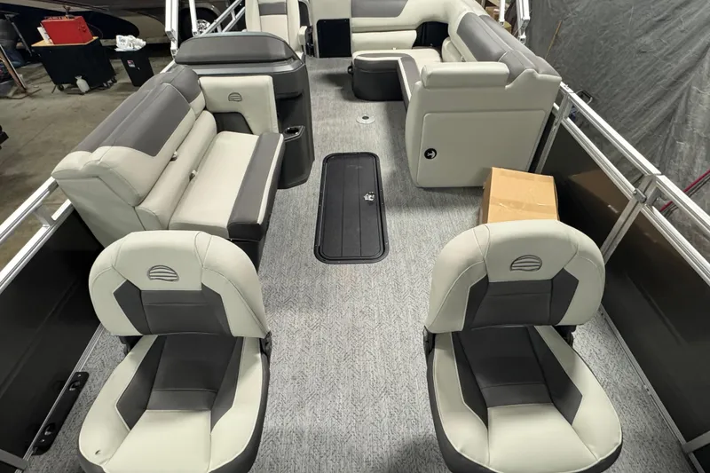 Slide: The Image of 2026 Sun Tracker SportFish 22 XP3 interior with gray seating and spacious layout. - 26