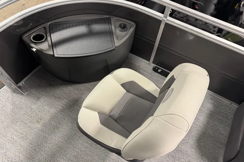 Slide: The Image of 2026 Sun Tracker SportFish 22 XP3 boat interior with cushioned seat and console. - 6