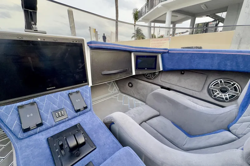 Slide: The Image of Interior of 2024 Dug Wright 32 with modern controls and plush seating. - 19