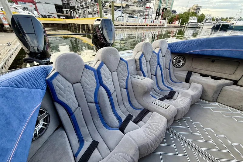 Slide: The Image of Luxury seating on 2024 Dug Wright 32 boat, docked at marina. - 25