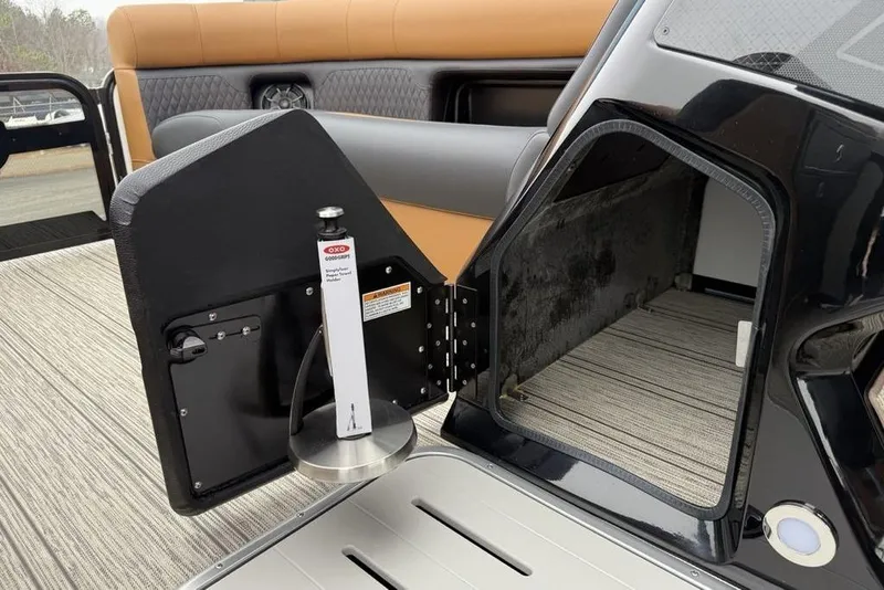 Slide: The Image of 2026 Premier 230 Sunsation RS CL boat interior with open storage compartment. - 14