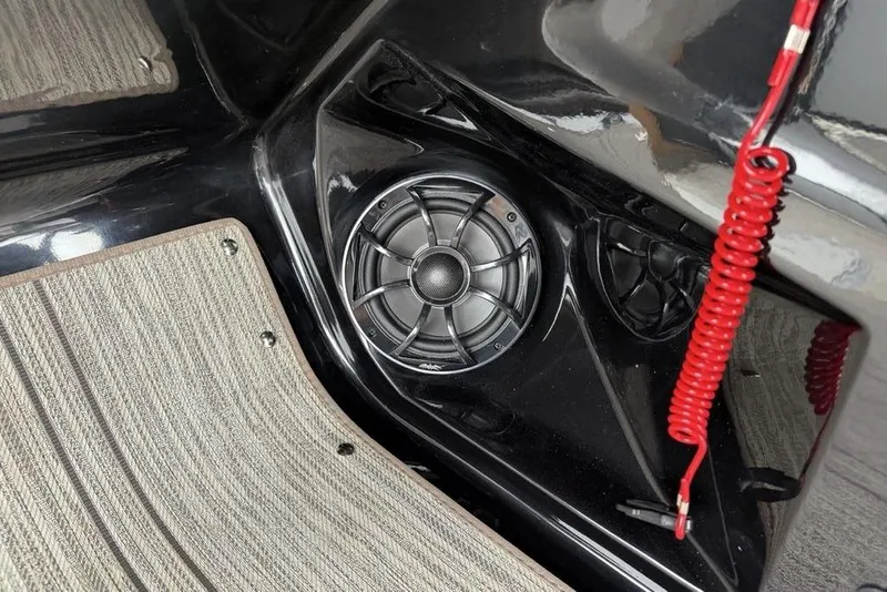 Slide: The Image of Speaker and red cord in 2026 Premier 230 Sunsation RS CL boat interior. - 25