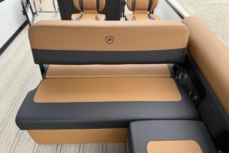 Slide: The Image of 2026 Premier 230 Sunsation RS CL boat interior with tan and black seating. - 27
