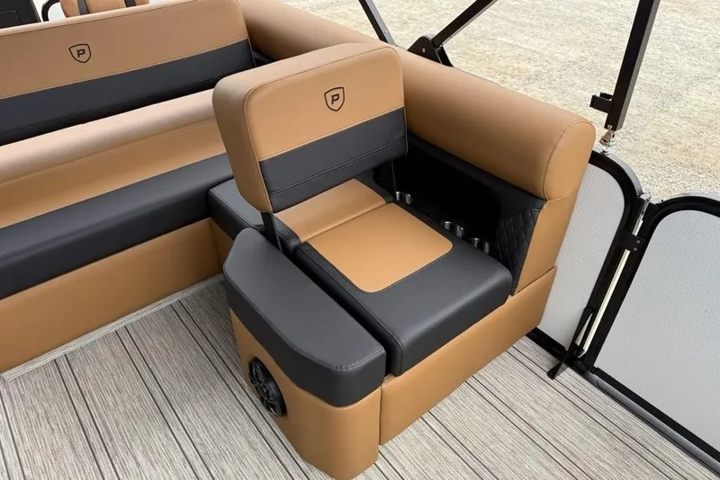 Slide: The Image of 2026 Premier 230 Sunsation RS CL boat interior with tan and black seating. - 28