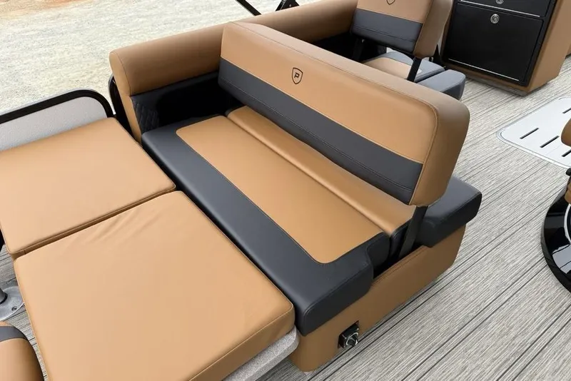 Slide: The Image of 2026 Premier 230 Sunsation RS CL boat interior with tan and black seating. - 31