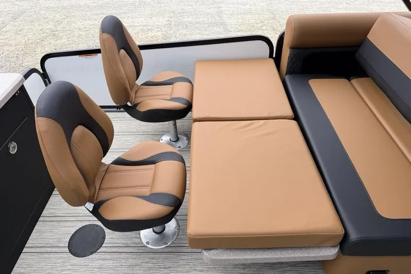 Slide: The Image of 2026 Premier 230 Sunsation RS CL boat interior with tan and black seating. - 32
