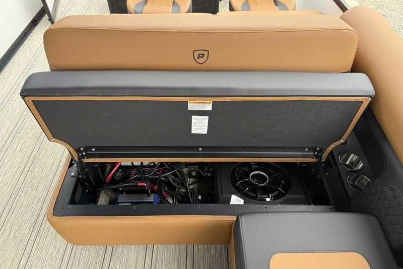 Slide: The Image of 2026 Premier 230 Sunsation RS CL boat seat storage with wiring and speaker system. - 33