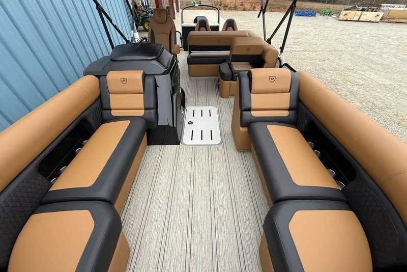 Slide: The Image of 2026 Premier 230 Sunsation RS CL pontoon boat with luxurious tan and black seating. - 36