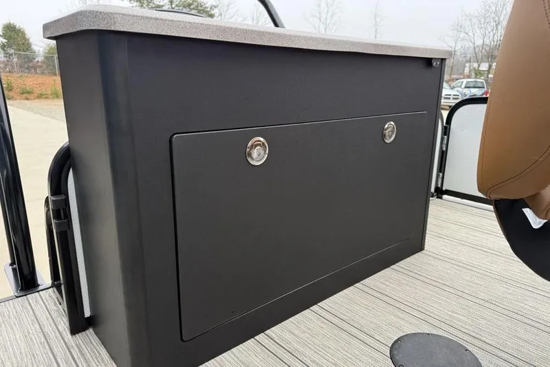 Slide: The Image of 2026 Premier 230 Sunsation RS CL boat storage compartment with secure lock and sleek design. - 39
