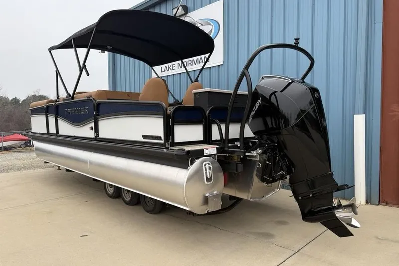 Slide: The Image of 2026 Premier 230 Sunsation RS CL pontoon boat with Mercury outboard motor, docked at Lake Norman. - 5