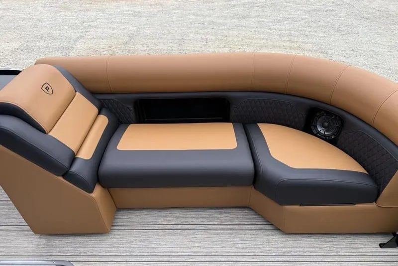 Slide: The Image of Luxurious seating on 2026 Premier 230 Sunsation RS CL pontoon boat, featuring tan and black upholstery. - 6