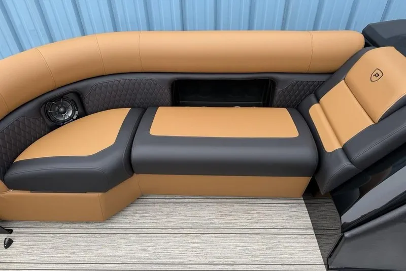 Slide: The Image of Luxurious seating on 2026 Premier 230 Sunsation RS CL boat, featuring tan and black upholstery. - 7