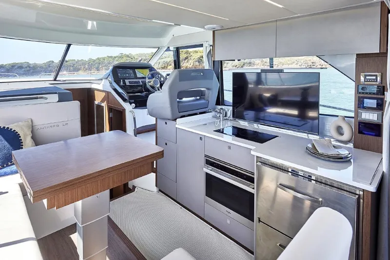 Slide: The Image of Luxurious interior of 2026 Beneteau Antares 12 Fly OB yacht with modern amenities. - 10