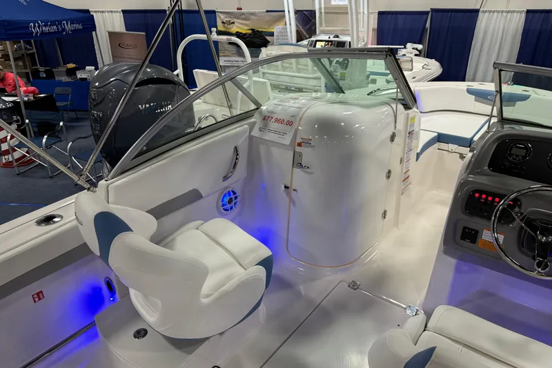 Slide: The Image of Manufacturer Provided Image: 2025 Robalo R207 Dual Console boat interior with modern dashboard and seating. - 19