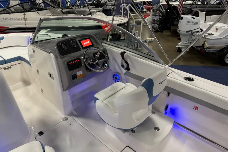 Slide: The Image of Manufacturer Provided Image: 2025 Robalo R207 Dual Console boat interior with cushioned seating and Yamaha engine. - 21
