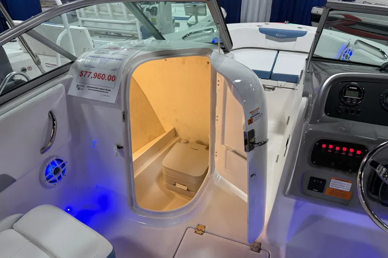 Slide: The Image of Manufacturer Provided Image: 2025 Robalo R207 Dual Console boat interior with Yamaha engine, featuring seating and storage. - 22