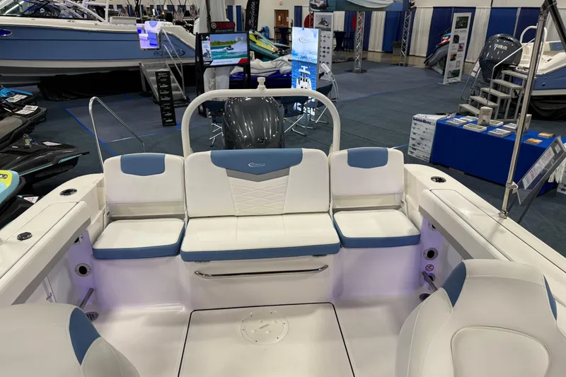 Slide: The Image of Manufacturer Provided Image: 2025 Robalo R207 Dual Console interior with open storage compartment and steering wheel. - 23