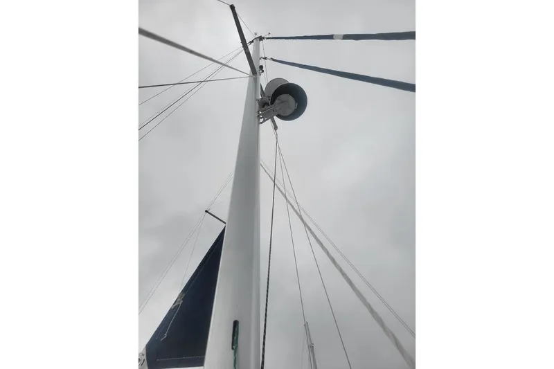 Slide: The Image of Mast and rigging of 2008 Island Packet 370 sailboat against cloudy sky. - 24