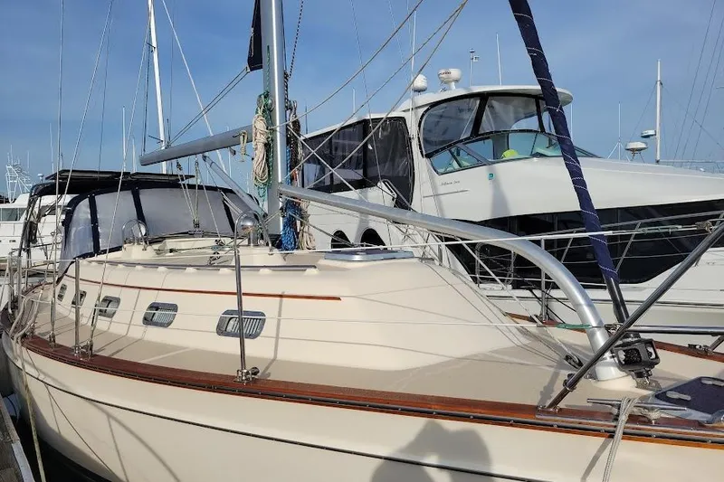 Slide: The Image of 2008 Island Packet 370 sailboat docked at marina, side view. - 4