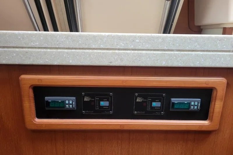 Slide: The Image of Control panel of a 2008 Island Packet 370 yacht with digital displays. - 77