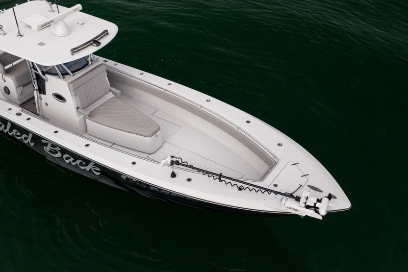 Slide: The Image of 2016 Contender 39 ST boat on water, aerial view, sleek design. - 10