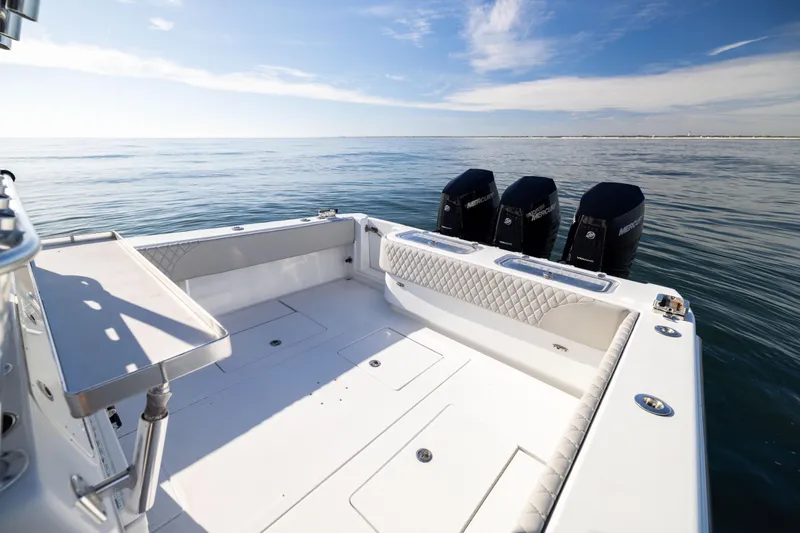 Slide: The Image of 2016 Contender 39 ST boat with triple Mercury engines on calm ocean. - 20