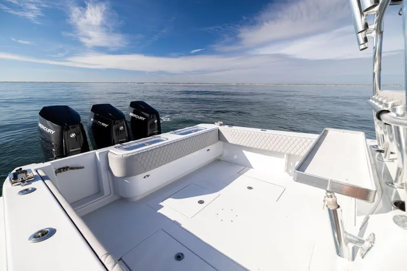 Slide: The Image of 2016 Contender 39 ST boat with triple Mercury engines on calm ocean. - 21