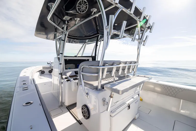 Slide: The Image of 2016 Contender 39 ST boat interior with sleek design and modern equipment on calm waters. - 29