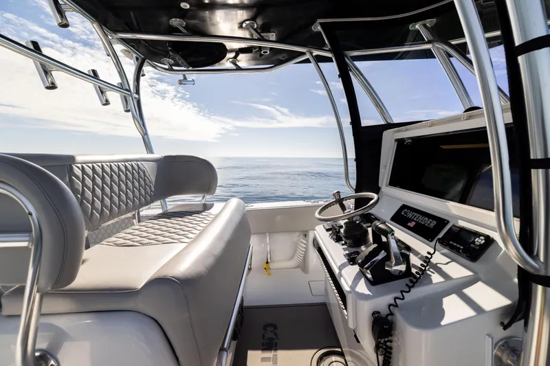 Slide: The Image of Interior view of 2016 Contender 39 ST boat cockpit with ocean backdrop. - 31