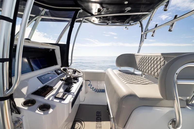Slide: The Image of 2016 Contender 39 ST boat interior with helm, seating, and ocean view. - 33
