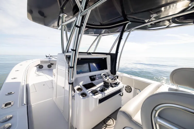 Slide: The Image of 2016 Contender 39 ST boat interior with helm, ocean view, and modern design. - 38