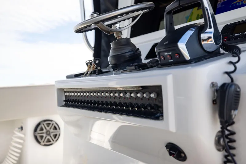 Slide: The Image of 2016 Contender 39 ST boat dashboard with controls and steering wheel. - 45