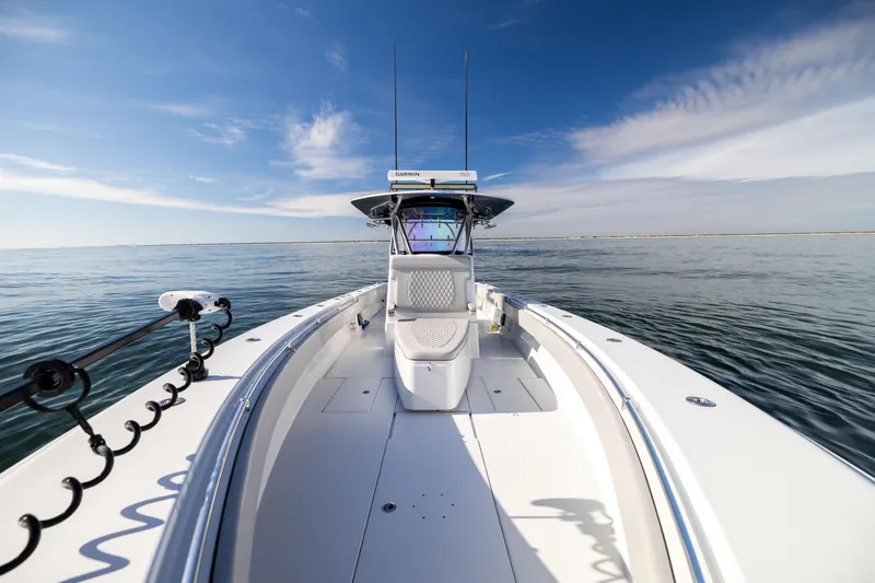 Slide: The Image of 2016 Contender 39 ST boat on calm ocean under clear blue sky. - 46