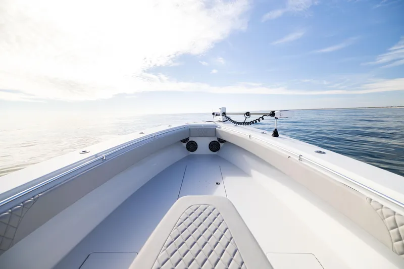 Slide: The Image of 2016 Contender 39 ST boat on calm ocean under clear blue sky. - 47