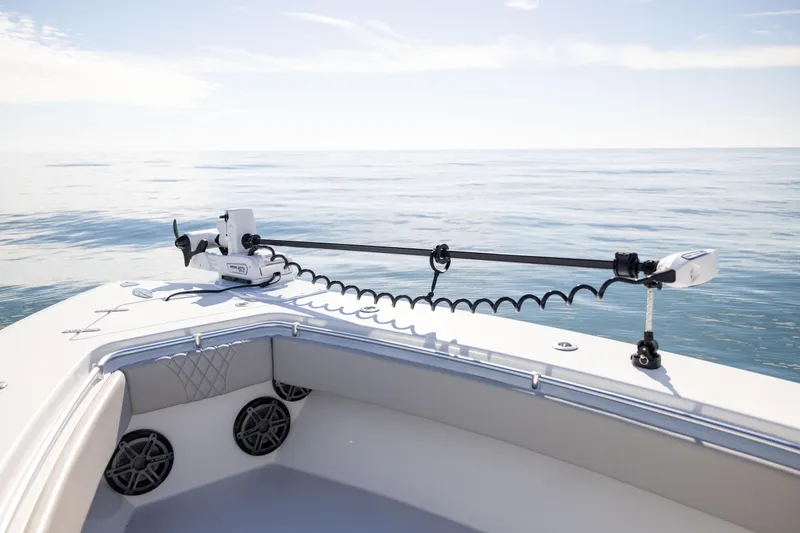 Slide: The Image of 2016 Contender 39 ST boat on calm ocean with trolling motor. - 50