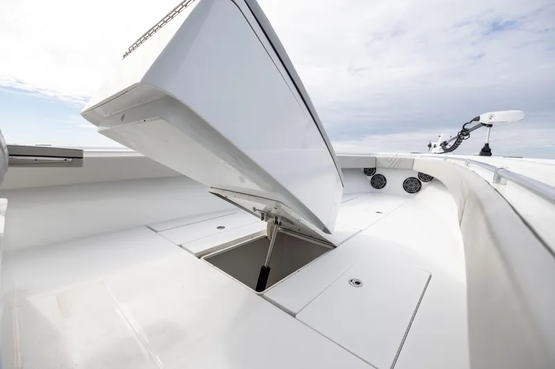 Slide: The Image of 2016 Contender 39 ST boat deck with open storage compartment. - 55