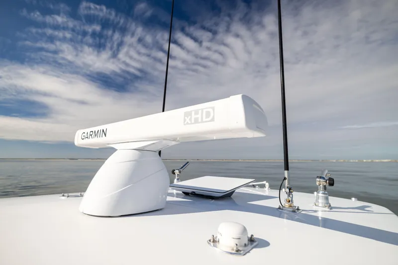 Slide: The Image of 2016 Contender 39 ST boat with Garmin xHD radar on calm water. - 58