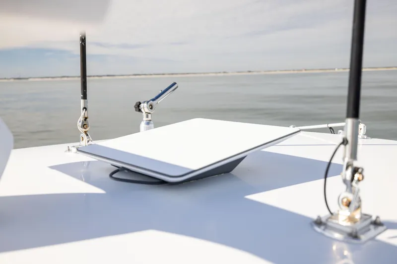 Slide: The Image of 2016 Contender 39 ST boat with mounted satellite dish on calm water. - 60