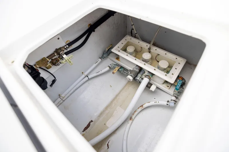 Slide: The Image of 2016 Contender 39 ST boat plumbing system with pipes and valves. - 66