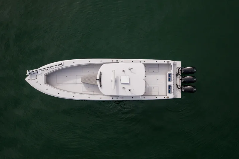 Slide: The Image of Overhead view of 2016 Contender 39 ST boat with triple outboard engines. - 9