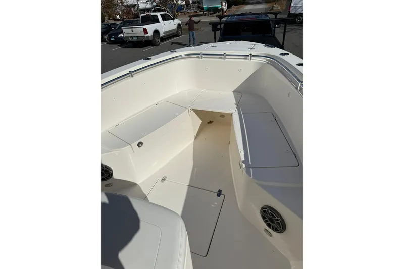 Slide: The Image of 2022 Cobia 262 Center Console boat interior with seating and storage compartments. - 16
